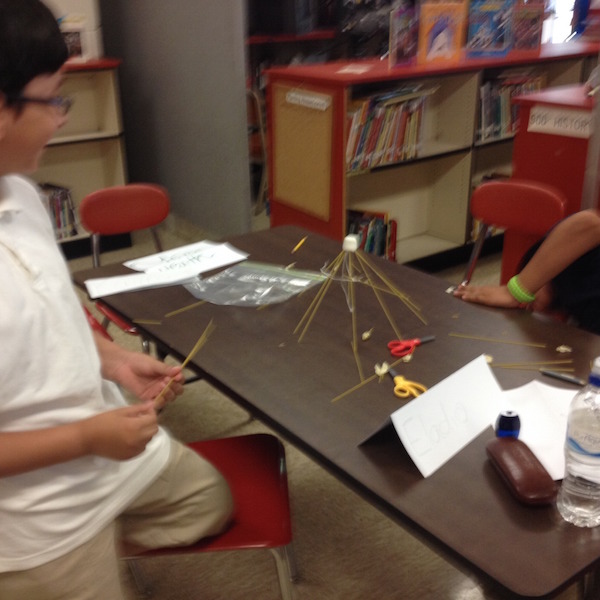 Student at Cool Spring Elementary build a structure